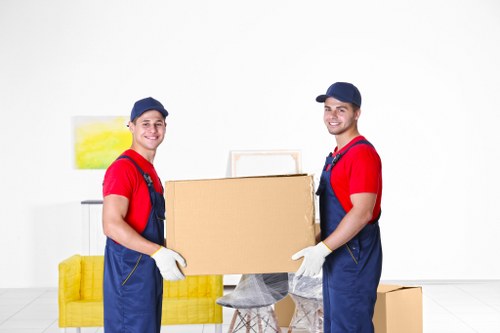 Storage team sorting recyclable cardboard and materials at Bigginhill Storage