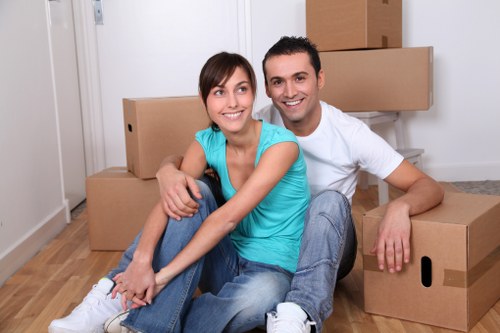 Professional movers loading furniture for a local removal
